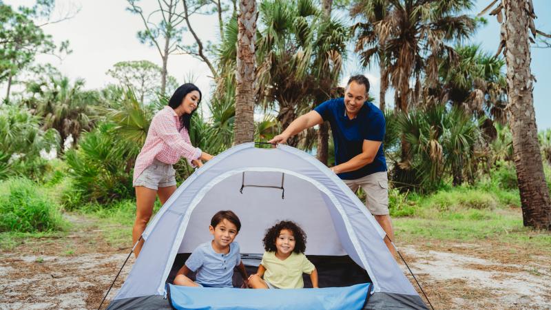 Family camping in a tent