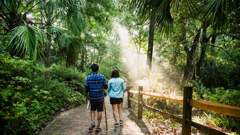Two people hike at Rainbow Springs State Park.